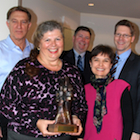 A group photo of the museum staff with their award.