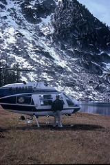 Lamarre stands beside a helicopter that provided transport into the East Goat Mountain exploration project in the Flint Creek Range of western Montana in 1978.