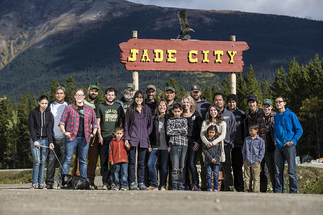 The citizens of Jade City, B.C.. standing under the sign of Jade City.