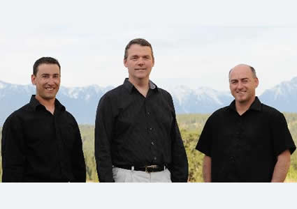 Three men standing side by side - owners of Vast Resource Solutions.