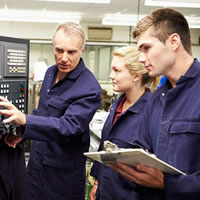 two trade students receiving training