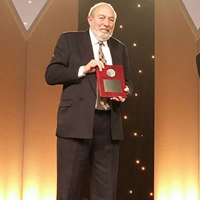 Simon Houlding proudly holding the Vale Medal for Meritorious Contributions to Mining award