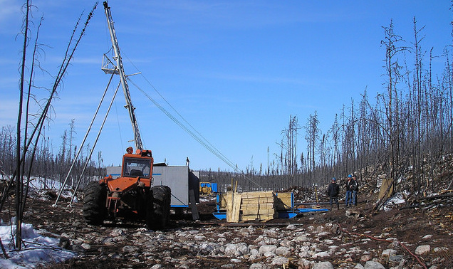 A tractor with a drilling rig is set up at the West McArthur site in 2012. 