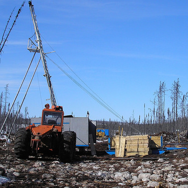 A tractor with a drilling rig is set up at the West McArthur site in 2012. 