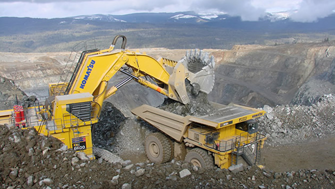 Heavy trucks at work at Copper Mountain mine site. 