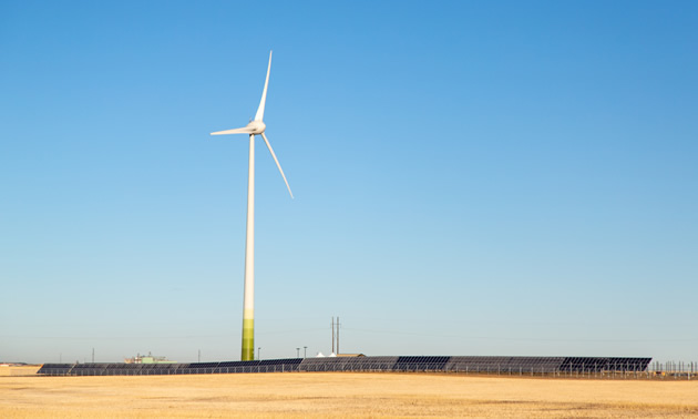 A wind turbine against a blue sky is part of Phase 1 of the Cowessess Renewable Energy Storage Facility.