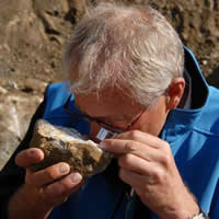 Dr. Axel Hoppe inspecting carbonatite rock sample from the Upper Fir.