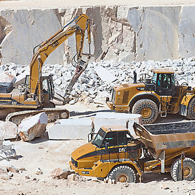Picture of heavy equipment working in rock quarry. 