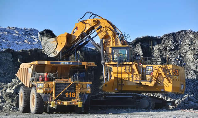 Photo of dump truck and excavator