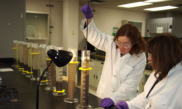 Heather Kaminsky is working in the lab at NAIT. 