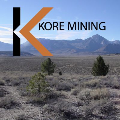 KORE Mining logo and picture of arid valley. 