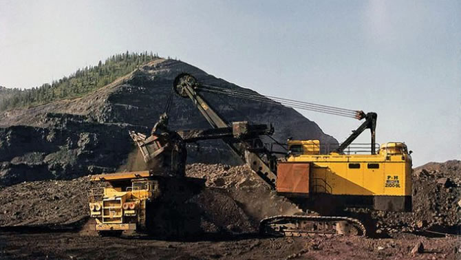Picture of heavy machinery at a mine site.