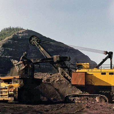 Picture of heavy machinery at a mine site.