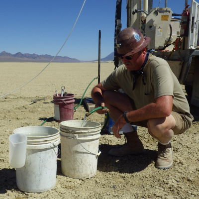 Nevada Exploration Inc.’s COO, Ken Tullar, collecting a groundwater from a direct push sample location.