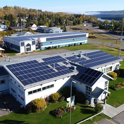 Aerial view of the solar arrays on the curling rink and municipal offices in Hudson's Hope, B.C.