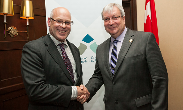 Pierre Gratton (l) pictured here with Minister Luc Blanchette