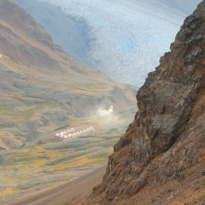 A view of a mining camp from a high-altitude location. 