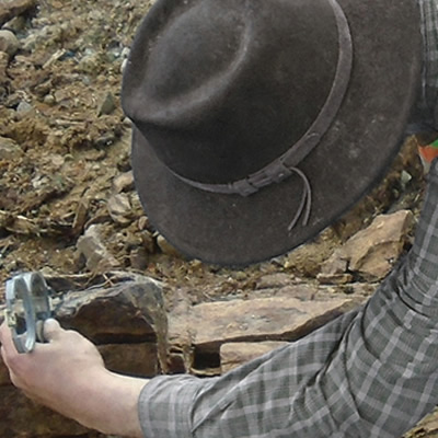 Worker studying rock samples. 
