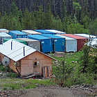 Buildings at a moly mining facility surrounded by mountains and trees