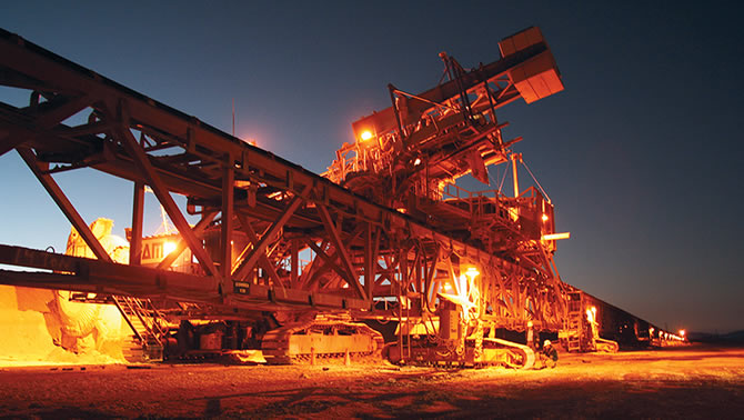 Nighttime picture of equipment at copper mine