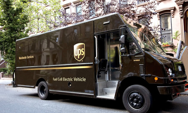 UPS Delivery van parked on street. 