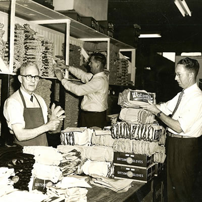 An old photo of men working at Watson Gloves, which is celebrating 100 years as a Canadian company.