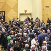 A crowd networking at a past AME BC conference. 