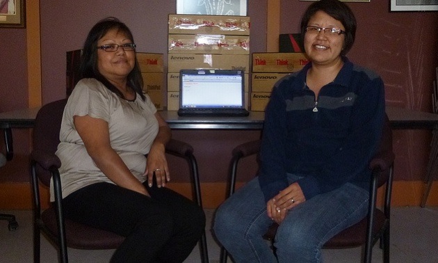 L-R: Francine Gurney, BC AMTA Program Coach and Cindy Clayton - BC AMTA Program Coordinator, with the laptops behind them that the software will be installed on.