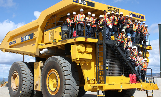 Photo of students on a big truck