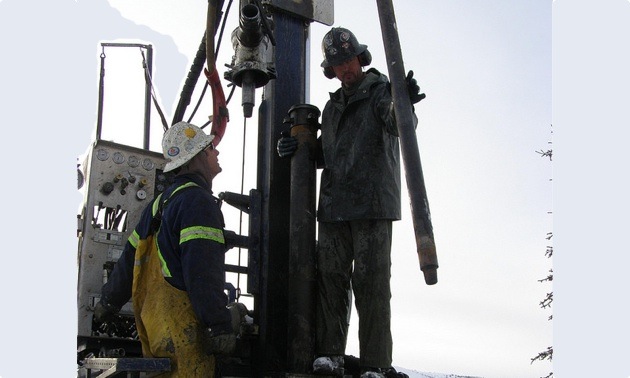 Drilling technicians are taking out core samples out from drilling cords.
