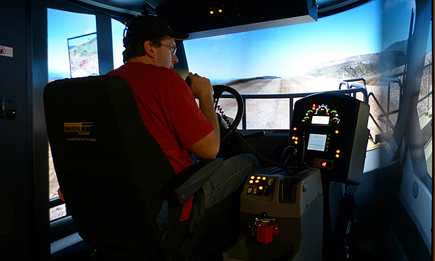 A man learning how to operate a haul truck at College of the Rockies. 