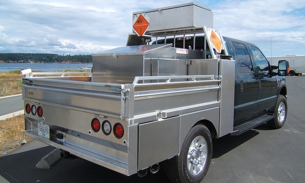 A CR Metal Fabricators truck with aluminum explosives transport box.