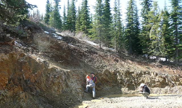 Photo of a large exploration pit at the Iron Range Property