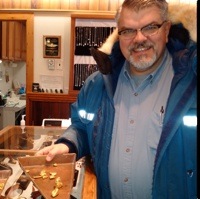 George Ross showing some gold nuggets that was mined near Dawson City by placer miners. 