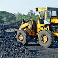 Photo bulldozer pushing coal
