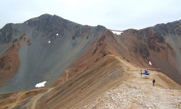 A helicopter is perched upon a ridge that marks the western boundary of the ore deposit for AuRico Gold Inc.’s proposed Kemess Underground Project, 250 kilometres north of Smithers, British Columbia. 