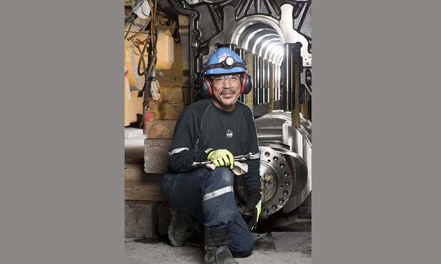 a man working in a mine with work gear on
