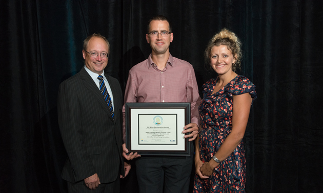 Ryan Mills accepting the Metal Mining Reclamation Award on behalf of the Crown Contaminated Sites Program of the Ministry of Forests, Lands and Natural Resource Operations and AECOM Canada Ltd. From left to right: Dave Nikolejsin (Deputy Minister of the Ministry of Energy and Mines), Ryan Mills (AECOM), Jaimie Dickson (2013 Chair, BC Technical & Research Committee on Reclamation).