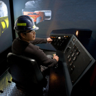 Trainees with MTS's Underground Mining Program utilize a $1.5 million simulator.