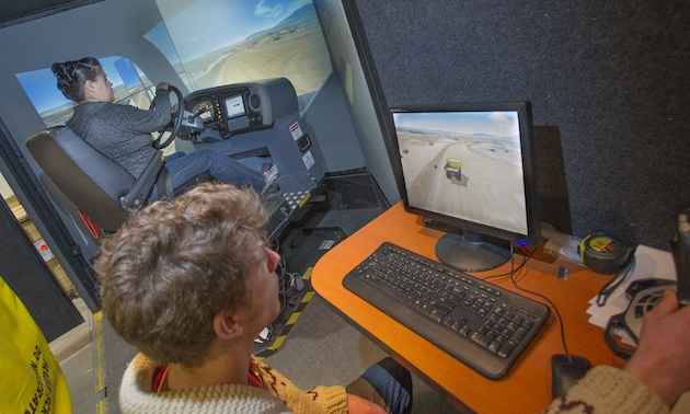 Yukon College students training on mining simulator programs.