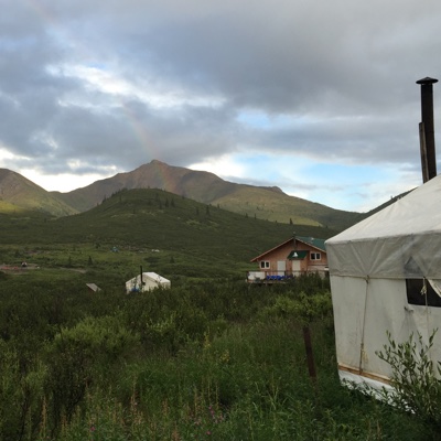 A photo of a mining camp with tents.