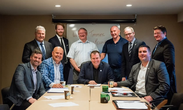 Chris Hodson, Cameron Grant, Bill MacRae, Tom Laughren, Kevin Edgson, Nick Stewart (first row), Derek Nighbor, Rocco Rossi, Mayor Steve Black and Paul-Emile McNab gathered in Timmins for a Resources Roundtable. 