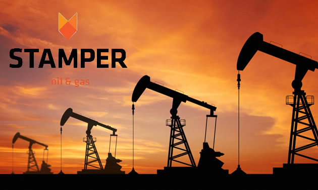 Picture of oil wells, silhouetted against sunset sky, with logo of Stamper Oil and Gas in top corner. 