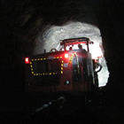 A large machine working in  an underground tunnel